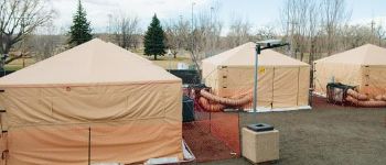 Three large humanitarian tents.