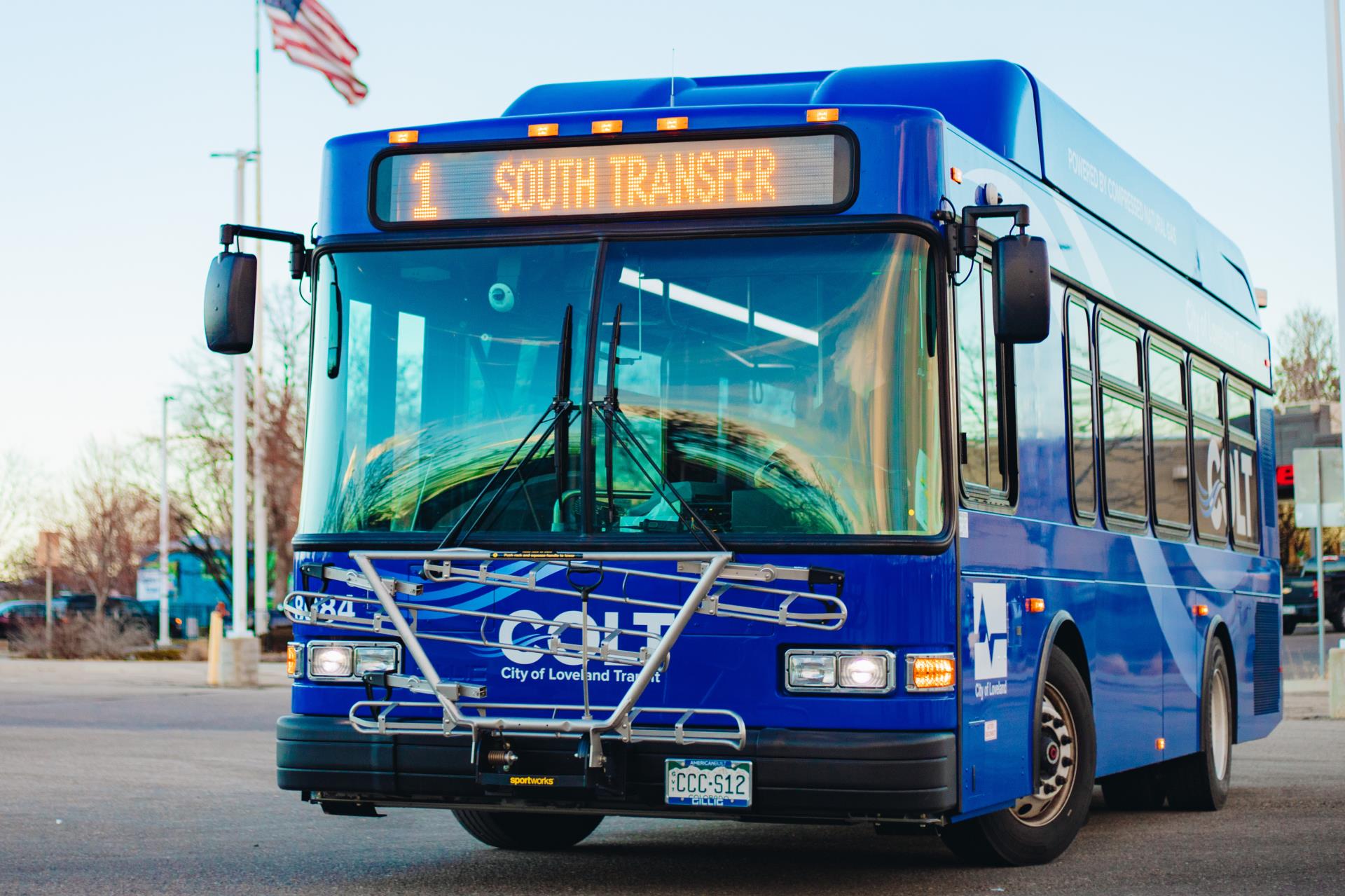 A COLT bus leaves a stop to head to South Transit Station