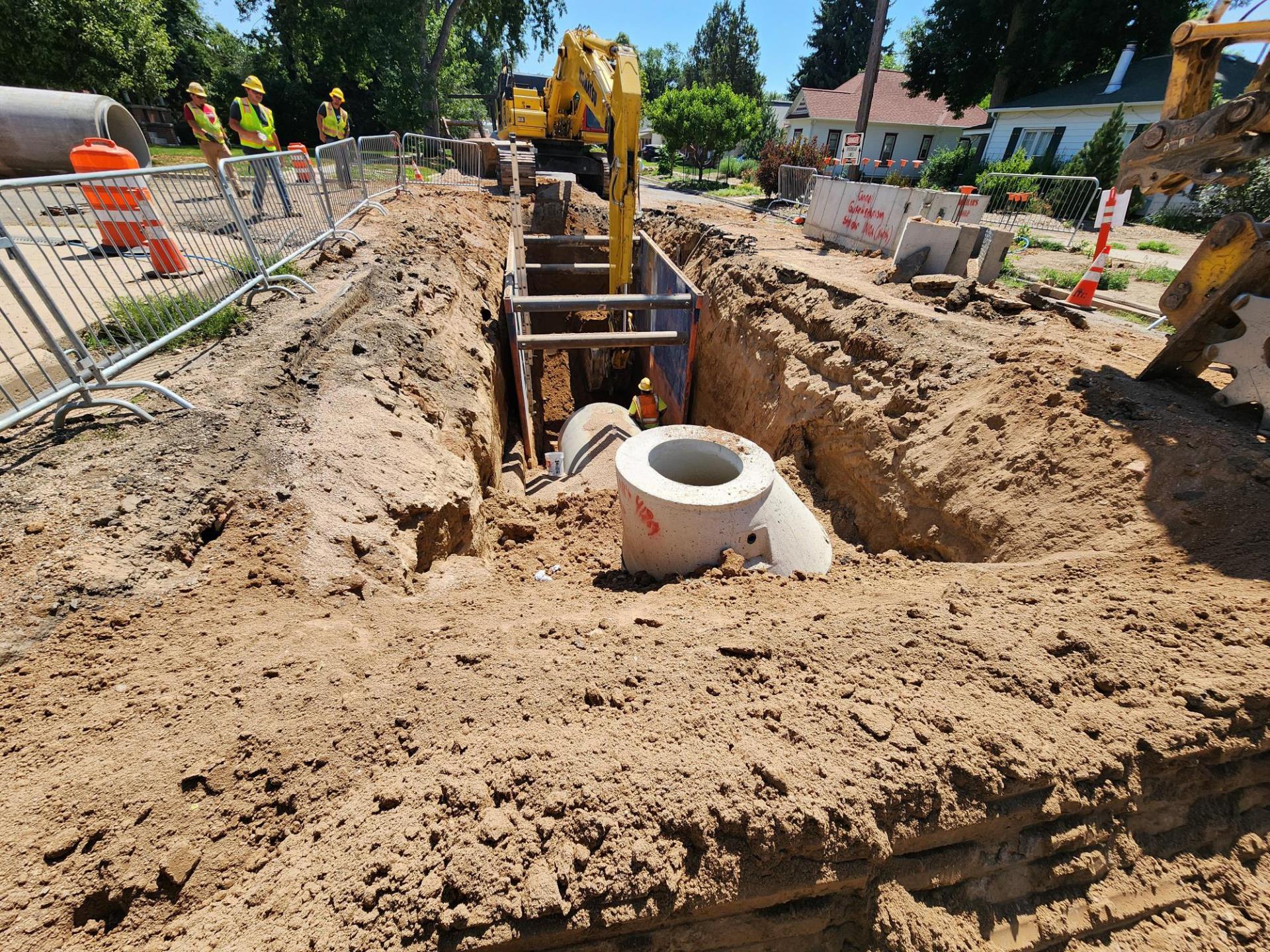 A pipe installation within a street for the Garfield-Harrison project.